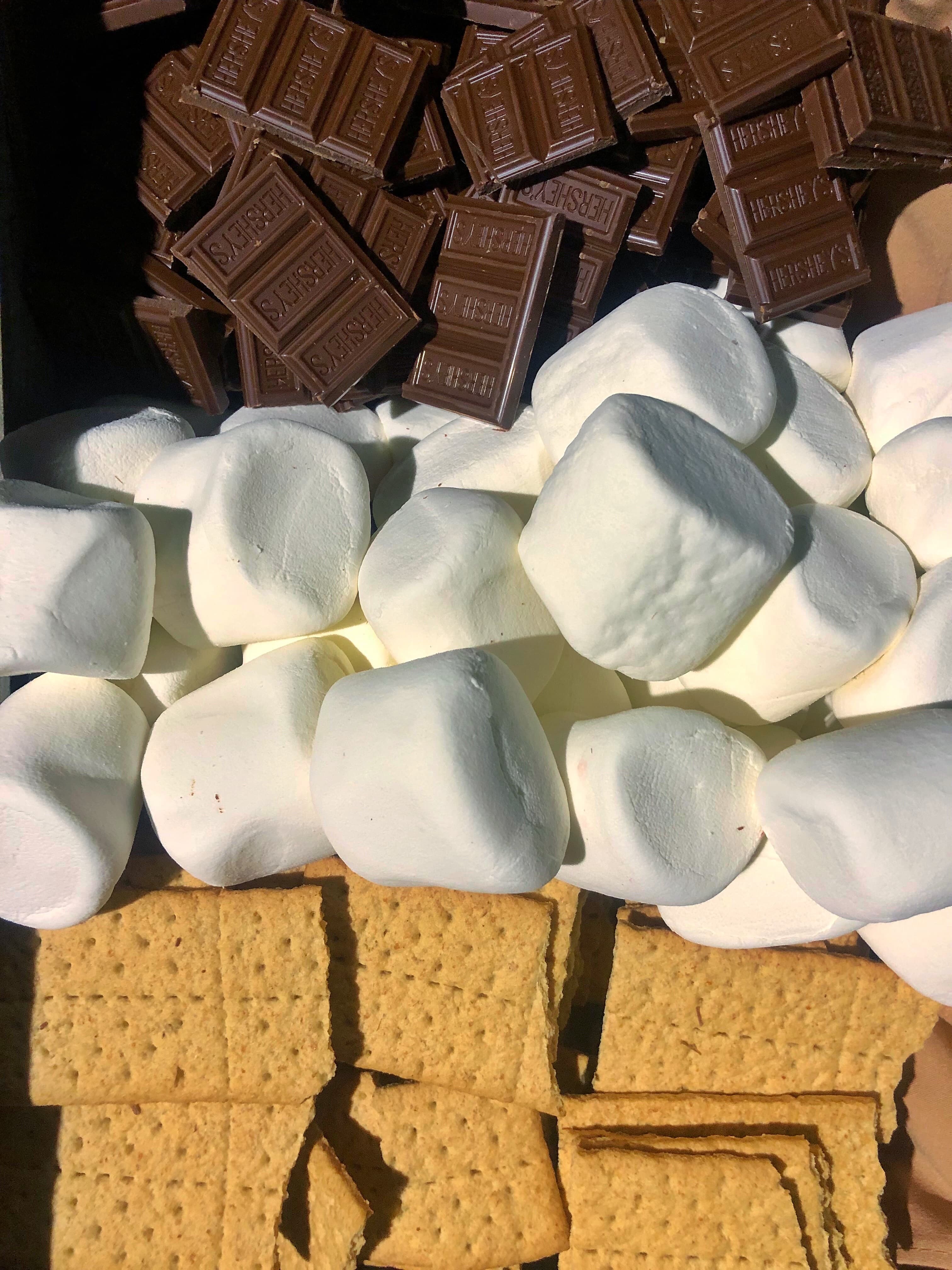 S'mores kit ingredients: chocolate, marshmallows, and graham crackers